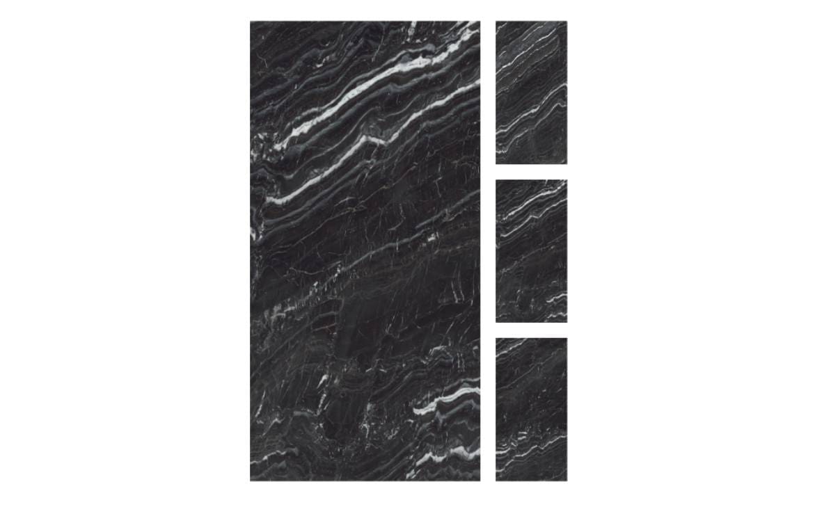 A black marble tile with three different designs.