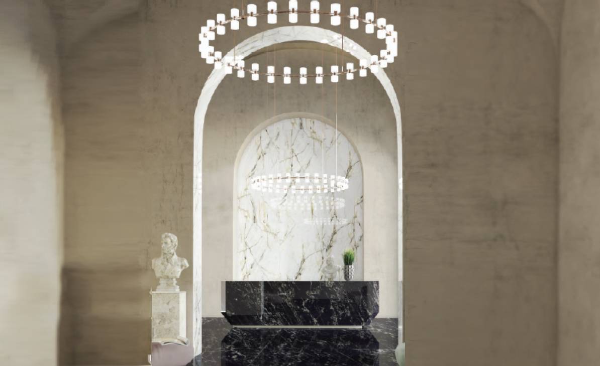 A marble wall with a black counter and white walls